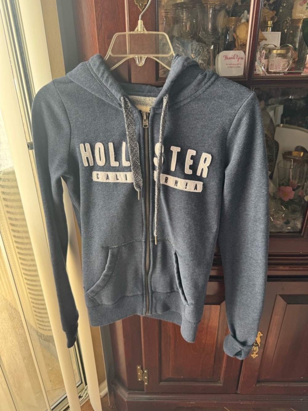 Hollister Dark Blue Zip-Up Hoodie with White Lettering